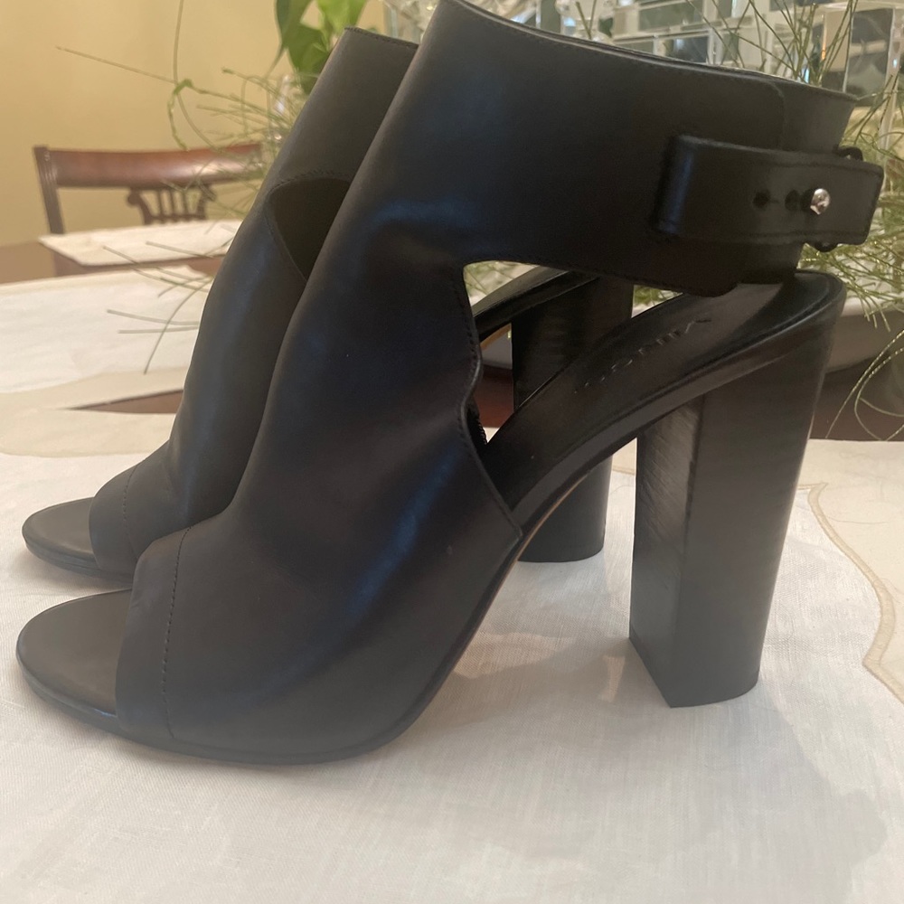 Black stacked heel. Heel/toe out. Ankle fasten. Very comfortable. Preowned